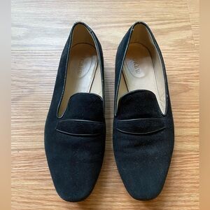 Black suede penny loafers.